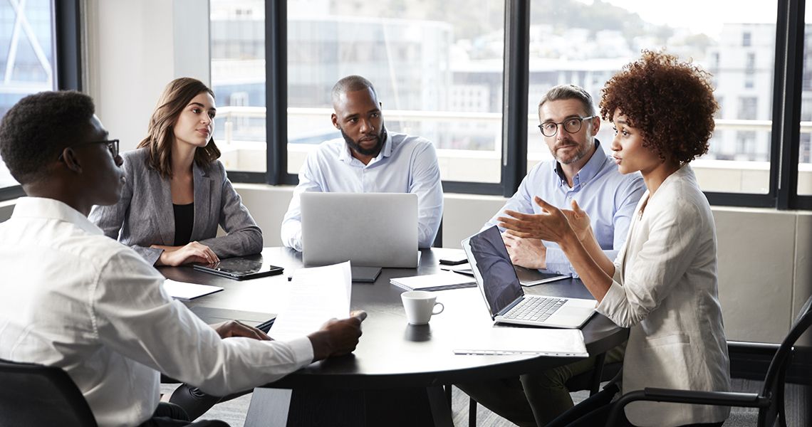 Person speaking to a group in a meeting